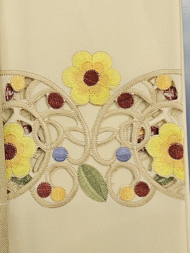 Cream guest towel with cutwork lace and colored flower embroidery